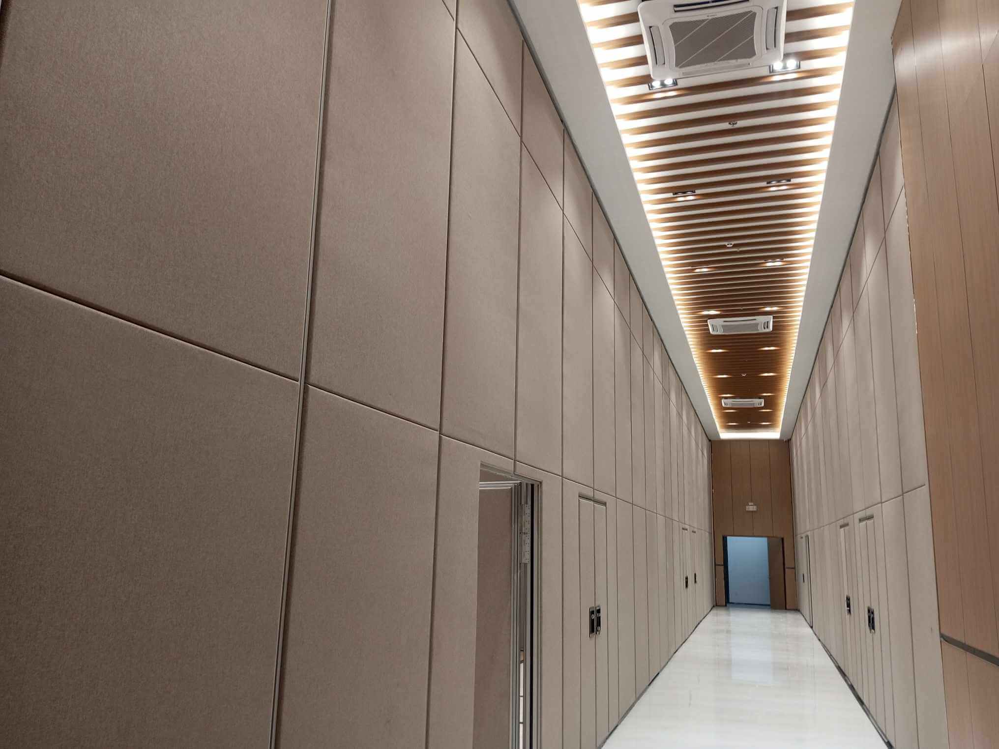 A melamine finish white folding wall divider used in a classroom in the Philippines.