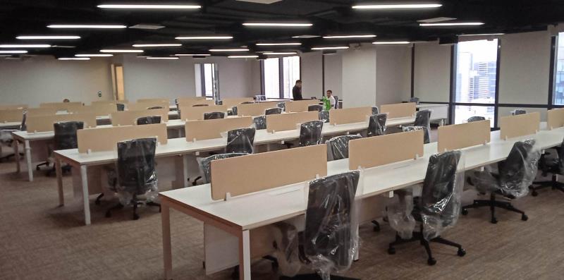 Modern office setup with ergonomic office chairs and partitioned desks from a supplier in the Philippines, designed for comfort and productivity.